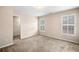 Bedroom with carpet flooring, and two windows with shutters at 1545 Heritage Trl, Roswell, GA 30075