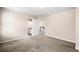 Bedroom view showcasing carpet, open door, and bathroom access at 1545 Heritage Trl, Roswell, GA 30075