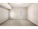 Spacious bedroom offering two windows with shutter, and neutral walls over carpet floors at 1545 Heritage Trl, Roswell, GA 30075