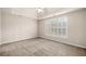 Bedroom featuring neutral carpet, natural lighting and high ceilings at 1545 Heritage Trl, Roswell, GA 30075