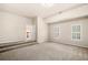 Bonus room featuring carpet, steps, and a walk-in entry at 1545 Heritage Trl, Roswell, GA 30075