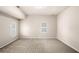 Spacious bonus room featuring neutral colored walls, carpet and natural light from two windows at 1545 Heritage Trl, Roswell, GA 30075