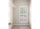 This carpeted closet features a wire shelf and a window with white shutters at 1545 Heritage Trl, Roswell, GA 30075