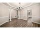 Dining room with hardwood floors and view into the kitchen at 1545 Heritage Trl, Roswell, GA 30075