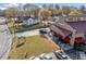 Charming exterior displaying an outdoor seating area, a well-kept lawn, and a roadside view of a commercial building at 1545 Heritage Trl, Roswell, GA 30075
