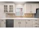 Close up of bright kitchen featuring white cabinets and modern appliances at 1545 Heritage Trl, Roswell, GA 30075