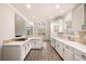 Well-lit kitchen with white cabinets, stainless steel appliances, backsplash, and an open layout at 1545 Heritage Trl, Roswell, GA 30075