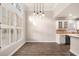 Bright, sunny kitchen area with bar seating, modern appliances, and hardwood flooring at 1545 Heritage Trl, Roswell, GA 30075