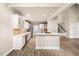 New modern kitchen with stainless steel appliances, white cabinets and hard wood flooring at 1545 Heritage Trl, Roswell, GA 30075
