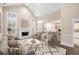 Staged living room featuring an open floor plan and fireplace with high ceilings at 1545 Heritage Trl, Roswell, GA 30075