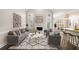 Open concept living room with vaulted ceilings, fireplace and view to kitchen at 1545 Heritage Trl, Roswell, GA 30075