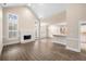 Open-concept living room featuring vaulted ceilings, a fireplace, and lots of light at 1545 Heritage Trl, Roswell, GA 30075