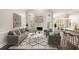Bright, staged living room with modern decor, fireplace, and open floor plan at 1545 Heritage Trl, Roswell, GA 30075