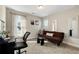 Bedroom featuring neutral walls and carpet, complete with window views and desk at 188 Harmony Woods Dr, Dallas, GA 30157