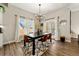 Cozy dining room with modern chandelier and lots of natural light at 188 Harmony Woods Dr, Dallas, GA 30157