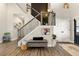 Elegant foyer featuring a staircase with rod iron spindles, hardwood floors, and neutral wall color at 188 Harmony Woods Dr, Dallas, GA 30157