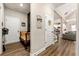 Hallway with hardwood floors, neutral walls, and bench at 188 Harmony Woods Dr, Dallas, GA 30157