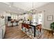 Open kitchen and dining area with modern light fixtures and stainless steel appliances at 188 Harmony Woods Dr, Dallas, GA 30157