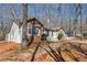 Exterior view of a beautiful stone-accented home with driveway at 332 Stonecutters Cv, Stockbridge, GA 30281