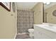 Bathroom features a patterned shower curtain, a white vanity, and neutral walls at 492 Broadstone Nw Way, Acworth, GA 30101