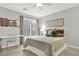 Sunlit bedroom with a soft color palette, complemented by decorative artwork and plush bedding, creates a soothing retreat at 492 Broadstone Nw Way, Acworth, GA 30101