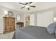 This bedroom offers natural light, neutral walls, and a ceiling fan, creating a cozy and inviting atmosphere at 492 Broadstone Nw Way, Acworth, GA 30101