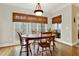 The dining room is light and bright, featuring a wood table and beautiful windows at 492 Broadstone Nw Way, Acworth, GA 30101