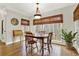 Dining room features a wooden table, hardwood floors, and natural light at 492 Broadstone Nw Way, Acworth, GA 30101