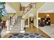 Inviting foyer with hardwood floors, staircase, and views into the living room, creating a warm and welcoming atmosphere at 492 Broadstone Nw Way, Acworth, GA 30101