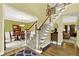 Inviting foyer with hardwood floors, staircase, and views into the dining room and living room, creating a warm atmosphere at 492 Broadstone Nw Way, Acworth, GA 30101