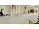 Open living area featuring a workout space and comfortable seating arrangement at 492 Broadstone Nw Way, Acworth, GA 30101