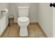 Compact powder room with neutral paint and tile floors at 492 Broadstone Nw Way, Acworth, GA 30101