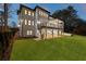 Home featuring a covered patio, spiral staircase, and lush backyard at 5238 Timber Ridge Rd, Marietta, GA 30068