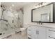 Modern bathroom with glass shower and granite vanity at 5238 Timber Ridge Rd, Marietta, GA 30068