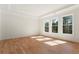 Bright bedroom featuring hardwood floors, large windows, and crown molding at 5238 Timber Ridge Rd, Marietta, GA 30068