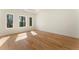 Bright bedroom with hardwood floors and multiple windows at 5238 Timber Ridge Rd, Marietta, GA 30068