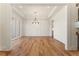 Bright dining room with hardwood floors, modern chandelier, and large window at 5238 Timber Ridge Rd, Marietta, GA 30068