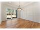 Dining area featuring wood floors, a modern chandelier, and a view of the backyard at 5238 Timber Ridge Rd, Marietta, GA 30068