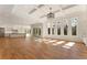 Living room open to kitchen with hardwood floors, and sliding doors to the patio at 5238 Timber Ridge Rd, Marietta, GA 30068