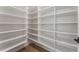 Walk-in pantry with extensive shelving for maximum storage capacity at 5238 Timber Ridge Rd, Marietta, GA 30068