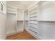 Open and bright walk-in closet with custom built-in shelving at 5238 Timber Ridge Rd, Marietta, GA 30068