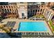 Aerial view of outdoor pool and seating area with historic building architecture at 170 Boulevard Se # 111H, Atlanta, GA 30312