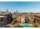 Aerial view of community buildings, pool, and the Atlanta skyline at 170 Boulevard Se # 111H, Atlanta, GA 30312