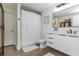 Clean bathroom with sleek modern fixtures and a shower with white curtain at 170 Boulevard Se # 111H, Atlanta, GA 30312