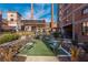 This courtyard has lounge chairs, astroturf, nice landscaping and is surrounded by brick buildings at 170 Boulevard Se # 111H, Atlanta, GA 30312