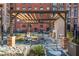 This courtyard has outdoor seating, fireplace, and is surrounded by brick buildings at 170 Boulevard Se # 111H, Atlanta, GA 30312