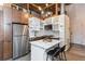 Modern kitchen featuring stainless steel appliances, white cabinets, and a central island at 170 Boulevard Se # 111H, Atlanta, GA 30312