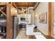 Well-lit kitchen with stainless steel appliances, modern cabinets, and a wine rack at 170 Boulevard Se # 111H, Atlanta, GA 30312