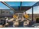 This roof deck has metal awning, lounge seating, yellow swing chairs and a view at 170 Boulevard Se # 111H, Atlanta, GA 30312