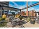 This roof deck has metal awning, lounge seating, hanging chairs and a beautiful view at 170 Boulevard Se # 111H, Atlanta, GA 30312